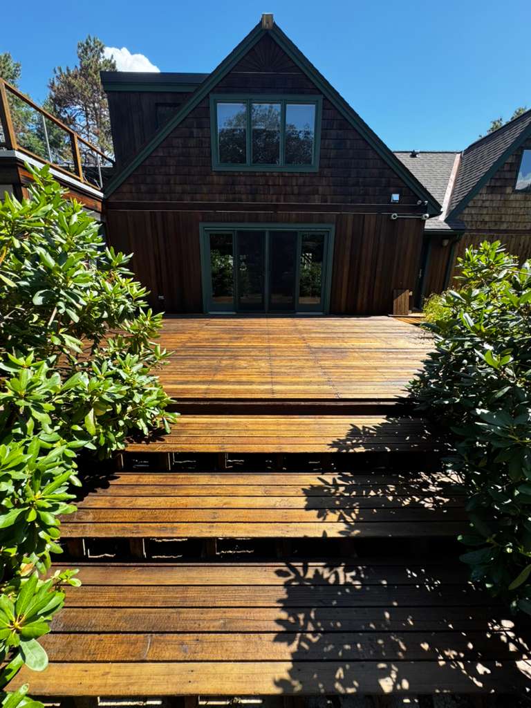 A 2026 exterior color trend: natural stain paired with color.